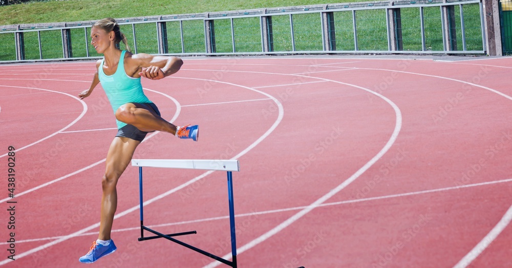 Composition of caucasian female runner over sports field