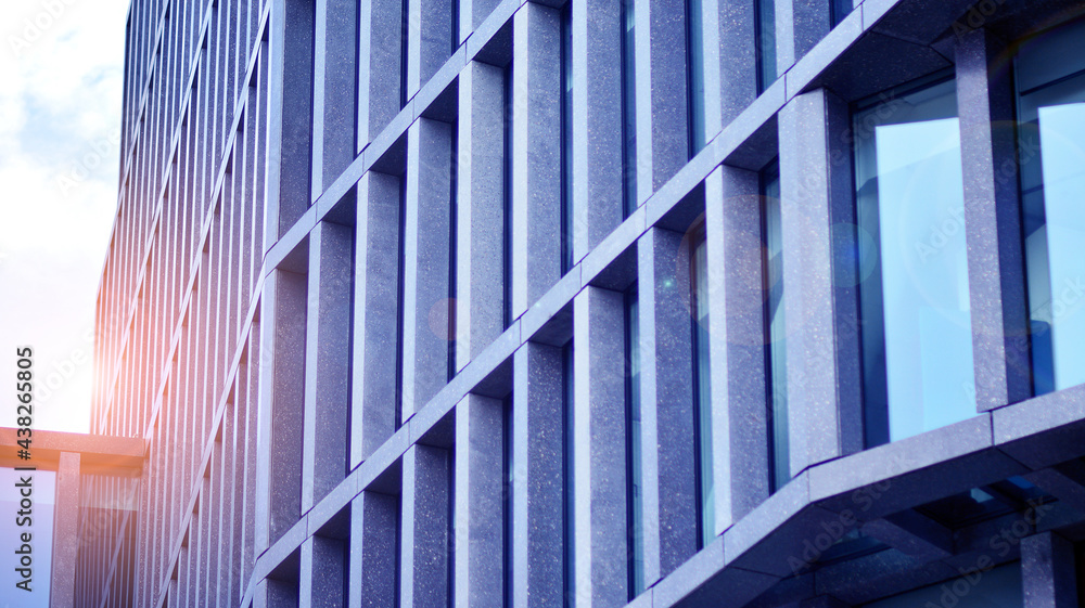 Abstract image of looking up at modern glass and concrete building. Architectural exterior detail of