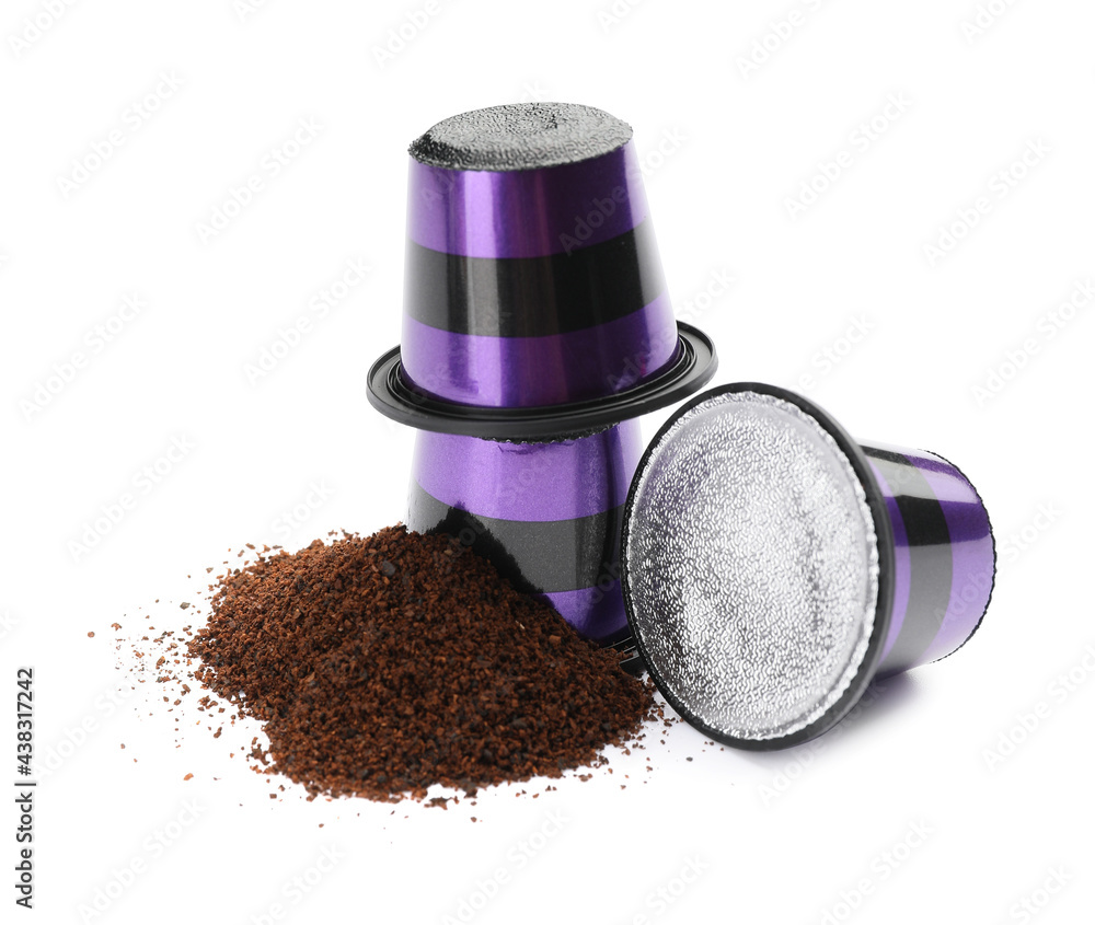 Coffee capsules with powder on white background