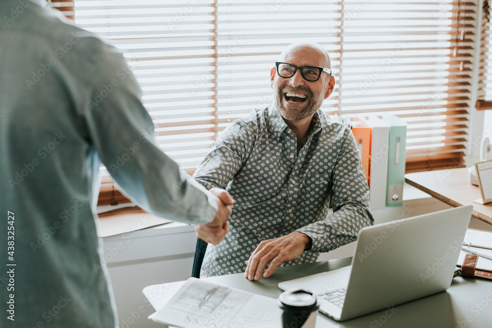 Businessman in an office shaking hands