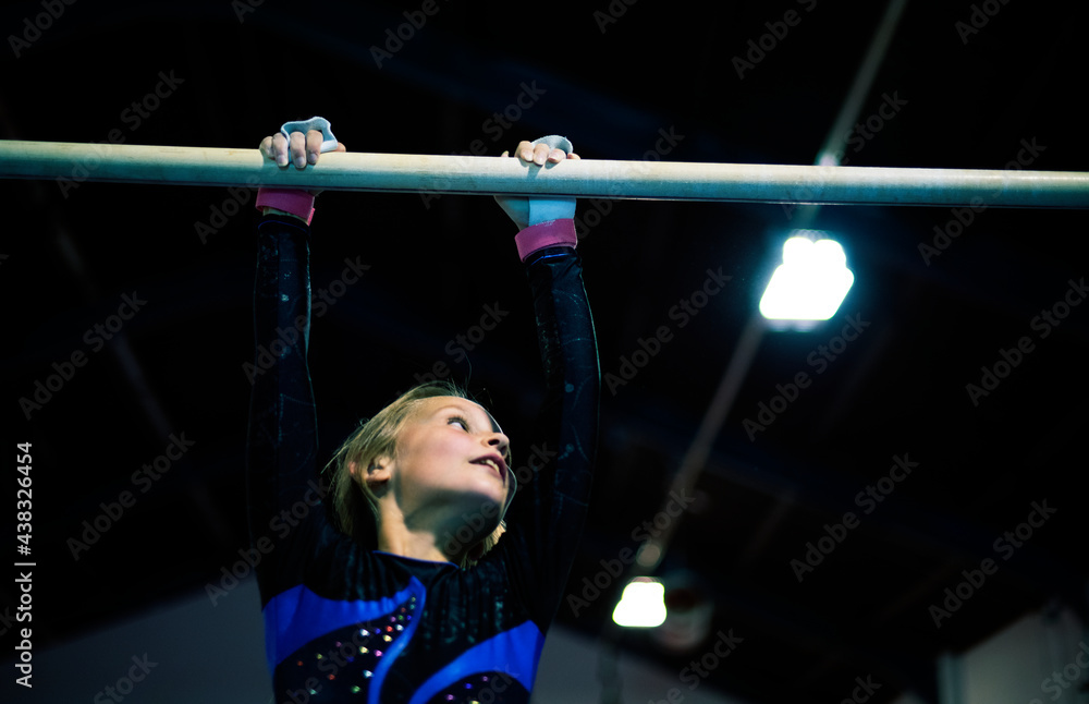 Young gymnast on a horizontal bar