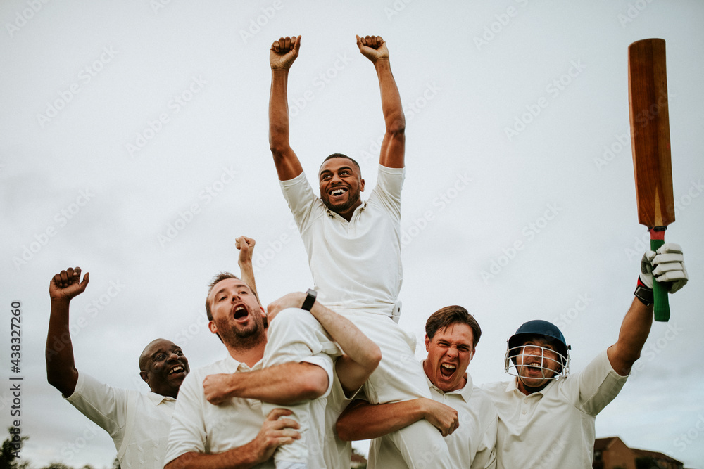 Cheerful cricketers celebrating their victory