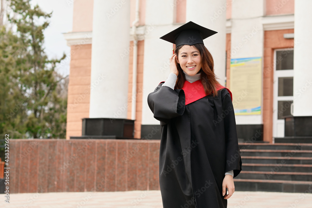 Female student in bachelor robe on her graduation day