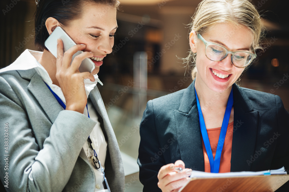 Two businesswomen working together