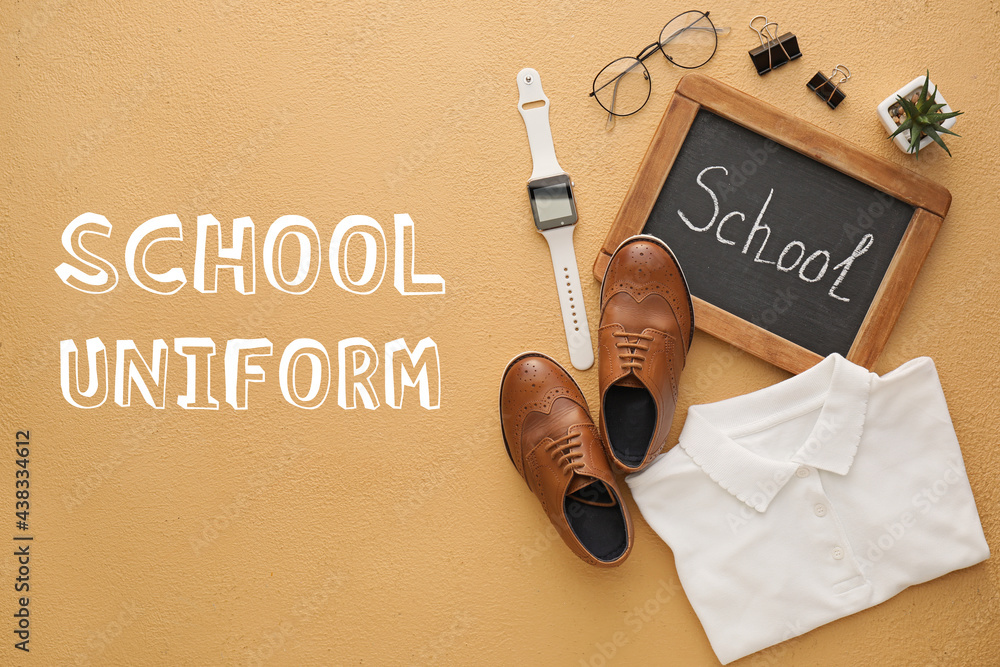 Stylish school uniform with blackboard and smart watch on color background