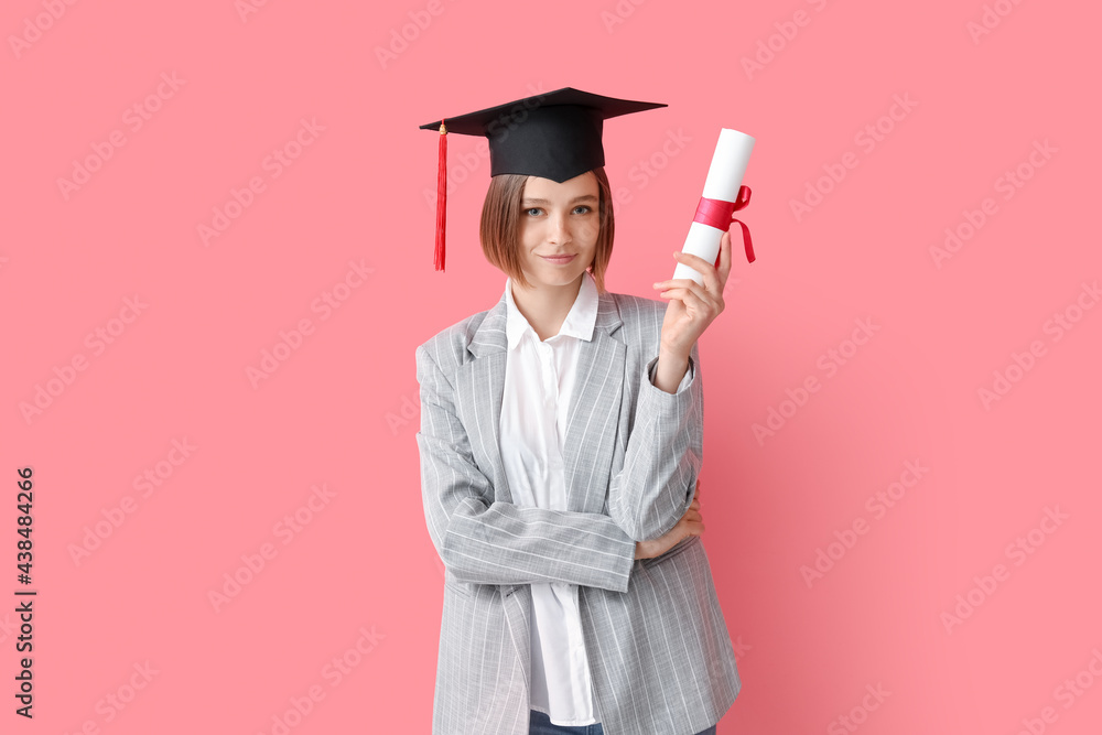 Female graduating student with diploma on color background