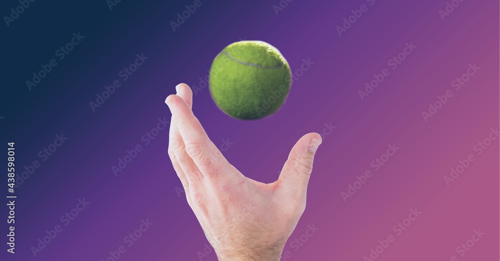 Composition of tennis ball over mans hand on purple background