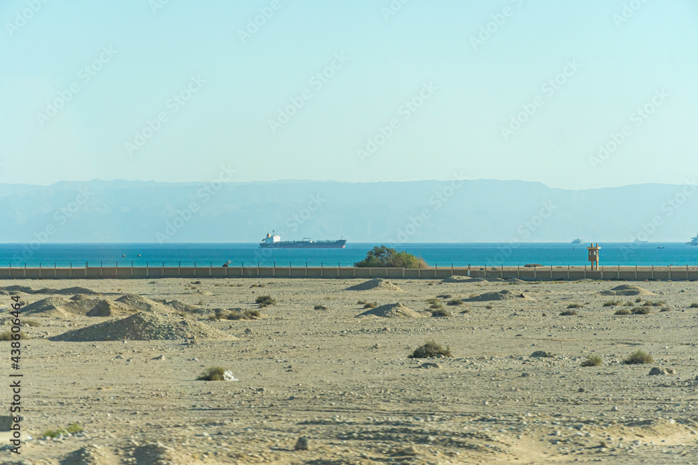 view of eastern side of the Suez Canal with picturesque desert sand dunes.