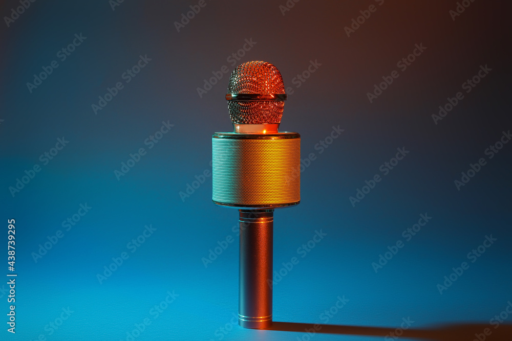 Modern microphone on dark color background