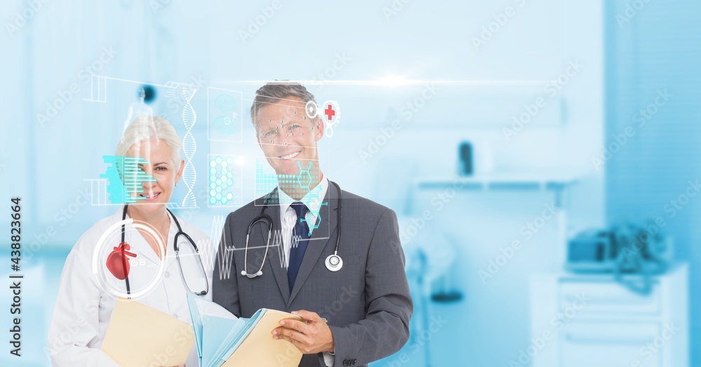 Composition of screen with medical data and icons over smiling male and female doctors