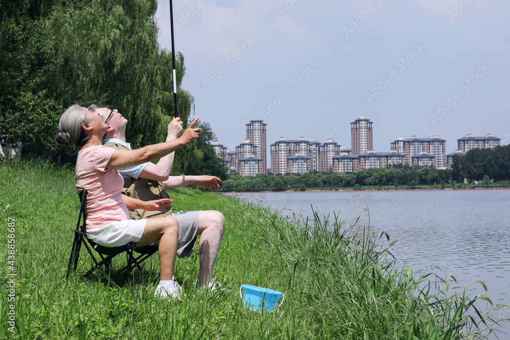 The Old couple fishing by the lake