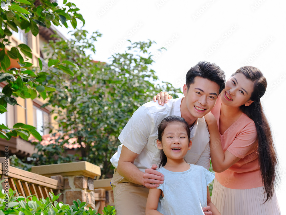 Happy family of three in the outdoor group photo