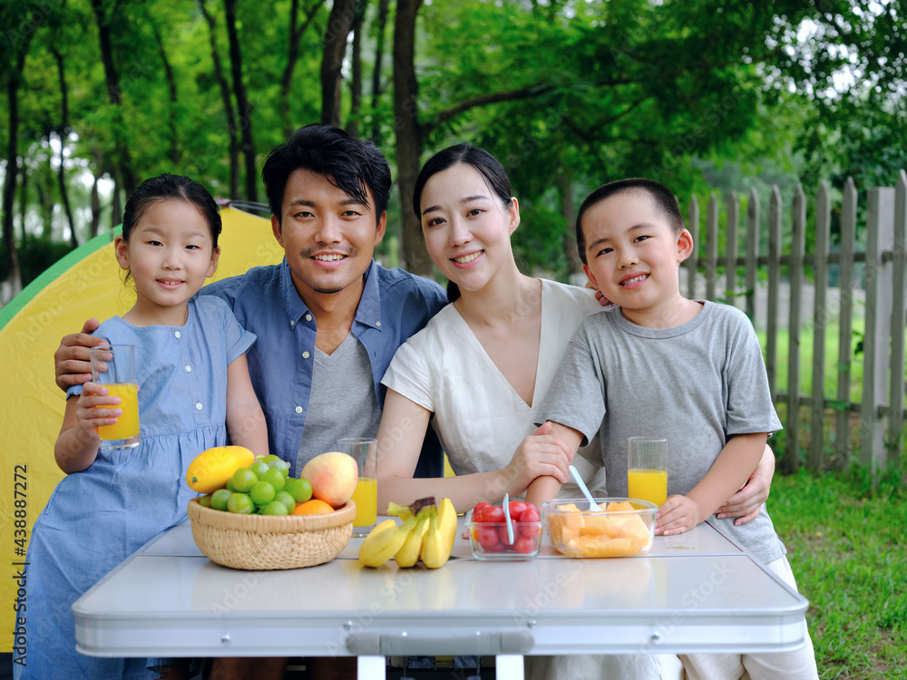 A Happy family of four outdoor outing