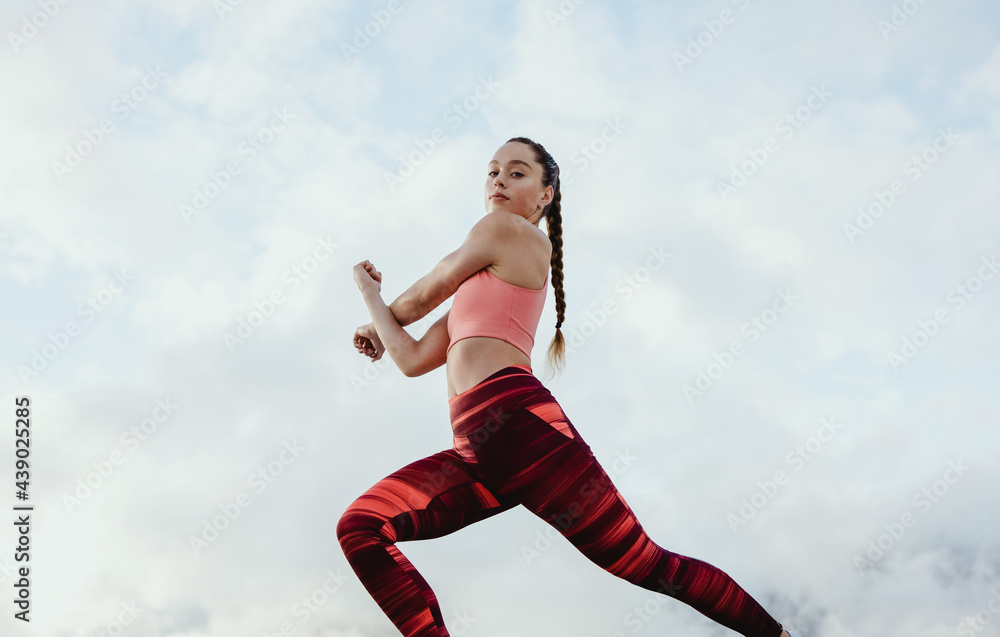 Athlete woman doing warmup stretching workout