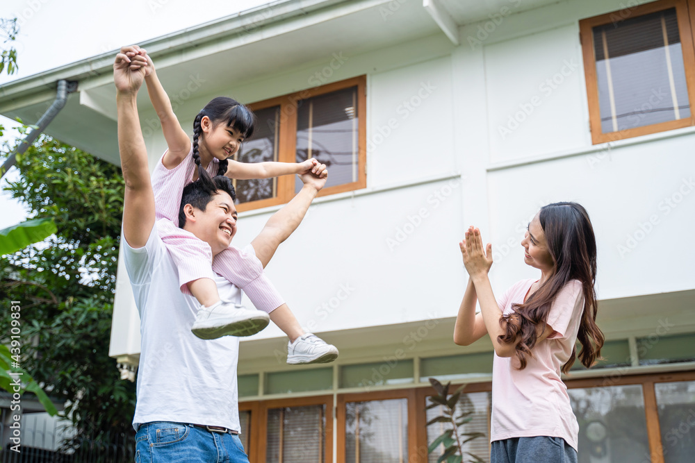 Asian family, parents and daughter play pilot of an airplane at home.