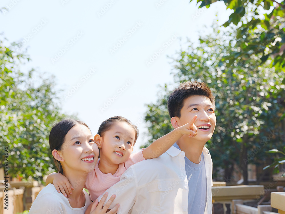 Happy family of three in the outdoor group photo