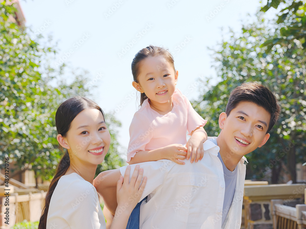 Happy family of three in the outdoor group photo