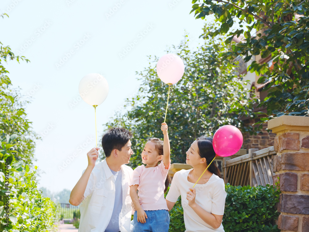 Happy family of three in the outdoor group photo