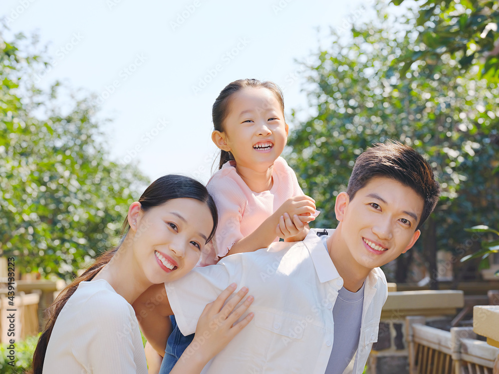 Happy family of three in the outdoor group photo