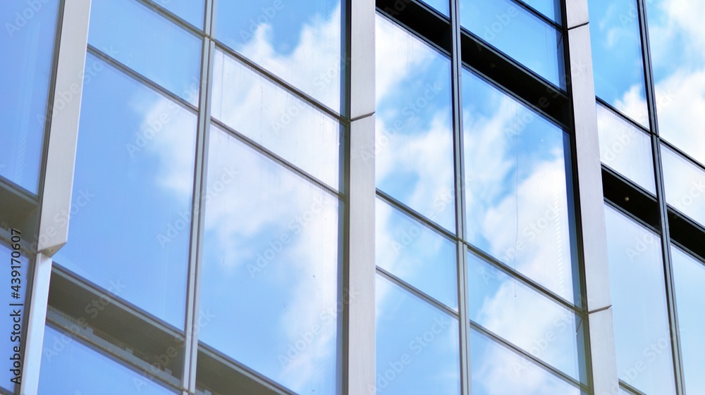 Glass and aluminum facade of a modern office building. View of futuristic architecture. Office build