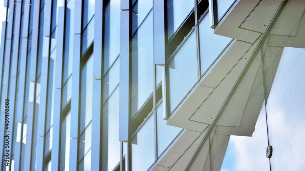 Glass and aluminum facade of a modern office building. View of futuristic architecture. Office build