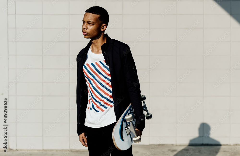 Teenager boy with a skateboard