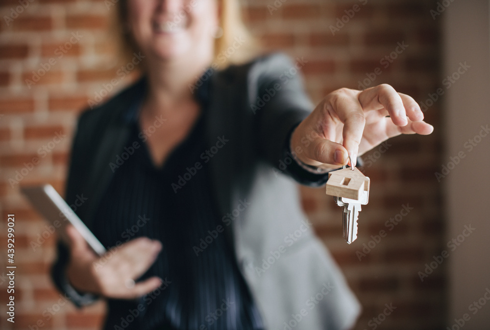 Real estate agent handing over the keys