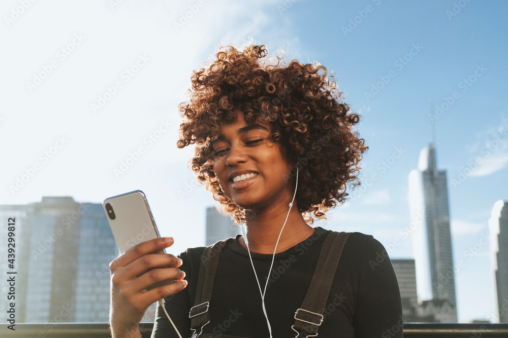 Girl listening to music from her phone