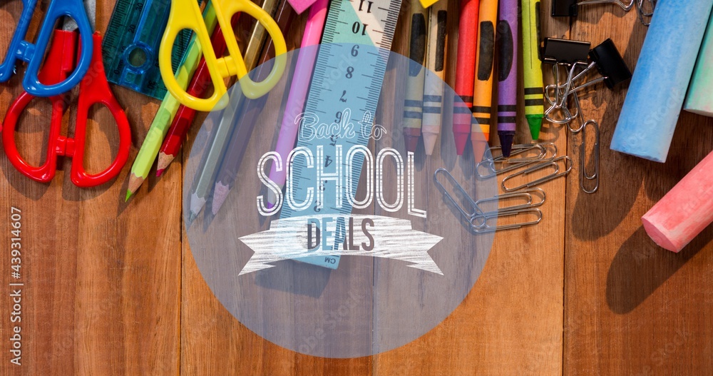 Composition of text school deals in white on blue circle, with school stationery on wooden desk