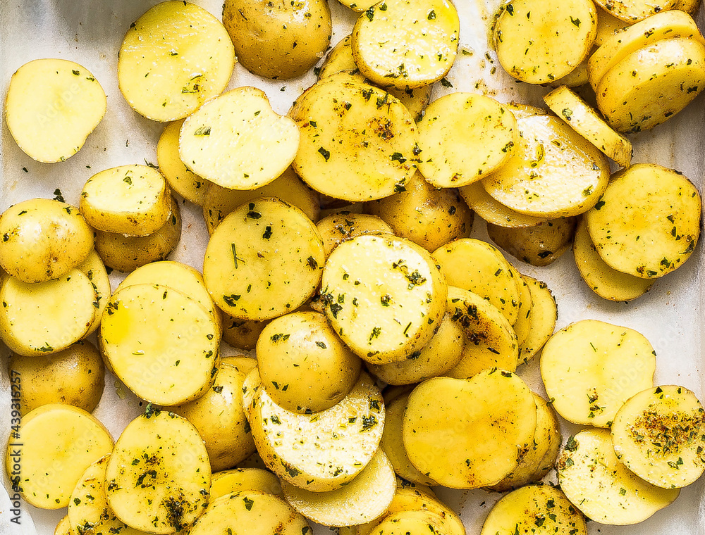 Sliced roasted potatoes on a tray