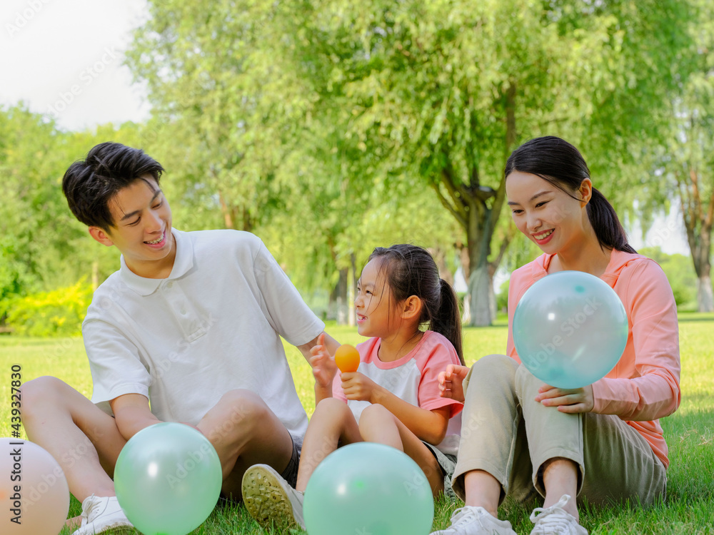 Happy family of three in the park