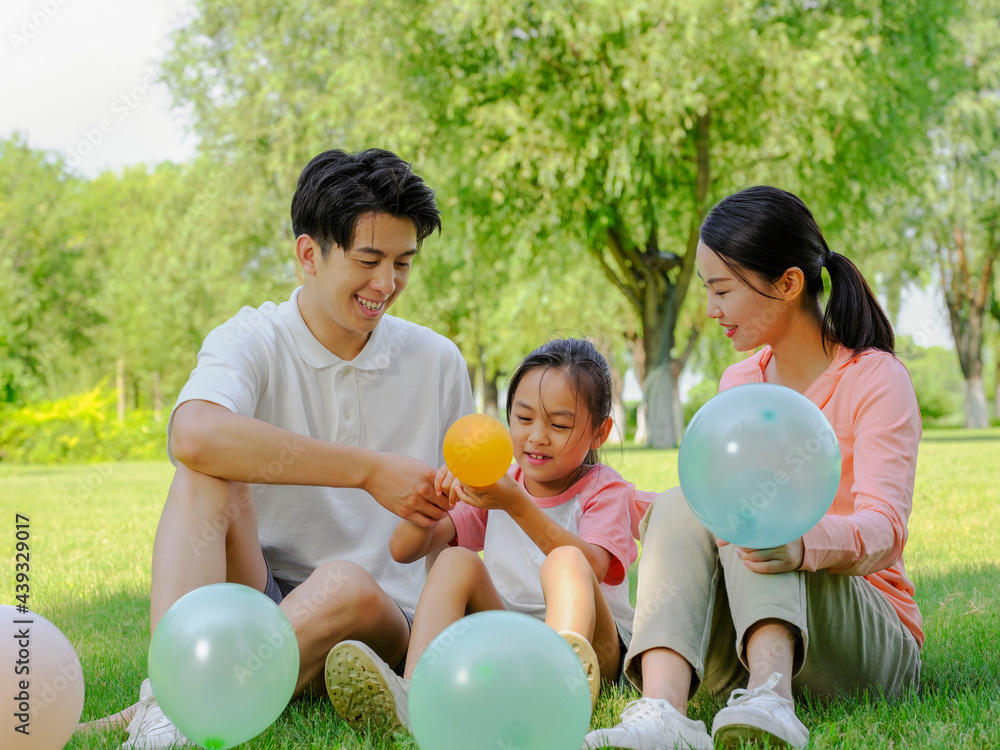 Happy family of three in the park