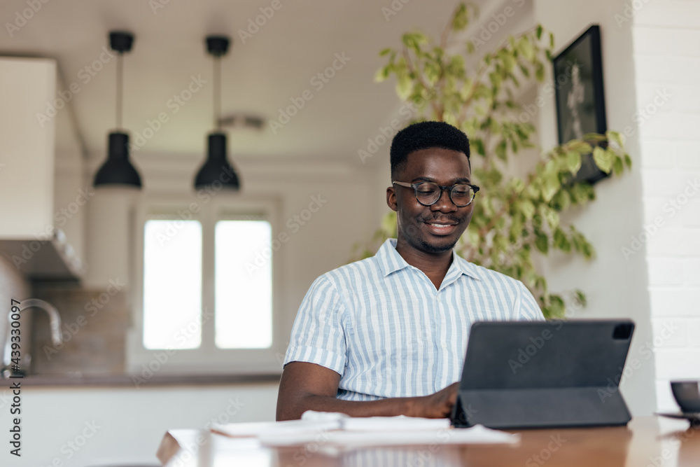 Adult man, doing his taxes on regular basis.