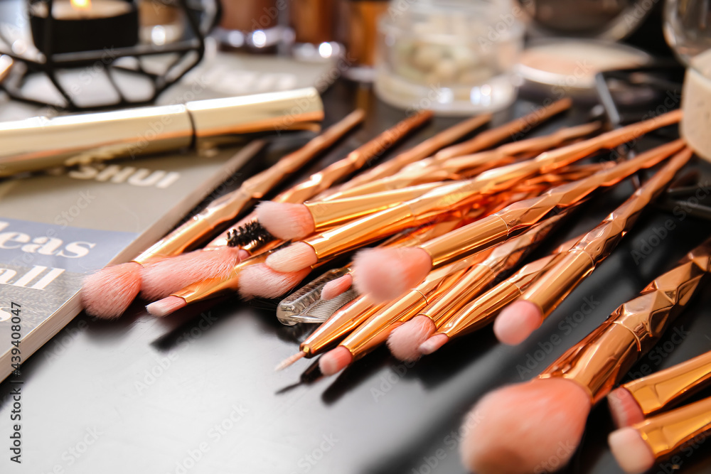 Set of makeup brushes on dressing table, closeup