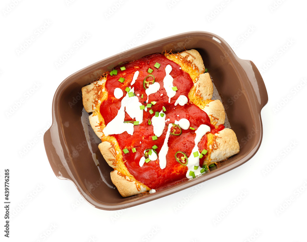 Baking dish with tasty cooked enchilada on white background