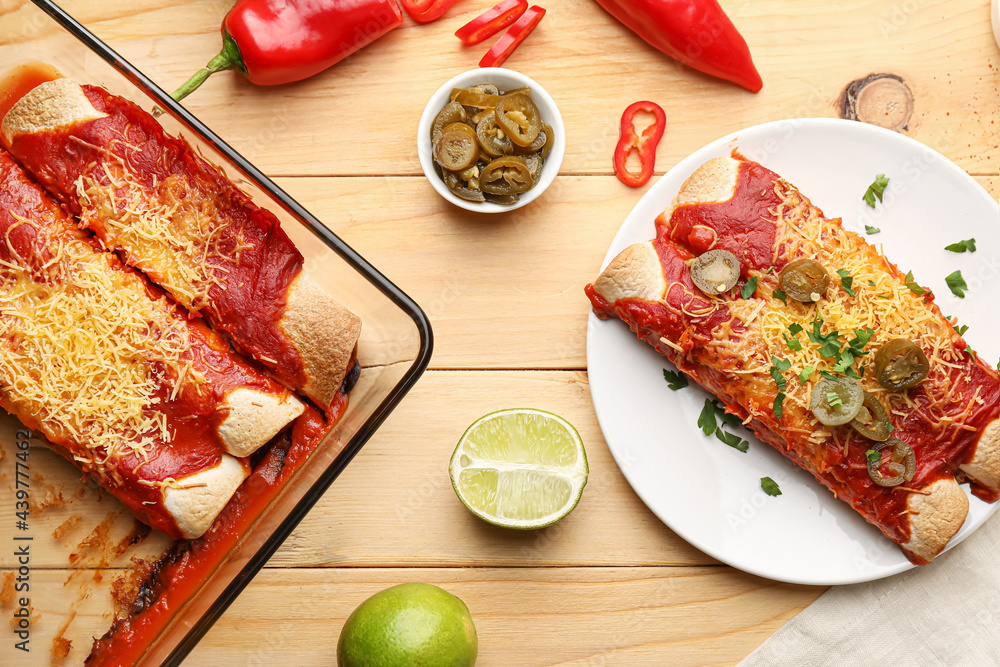 Tasty cooked enchilada on wooden background