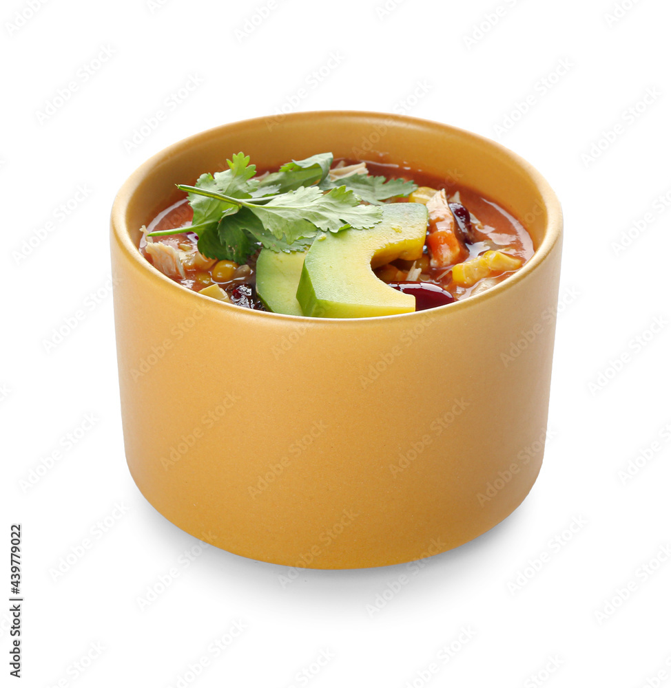 Bowl of tasty chicken enchilada soup on white background