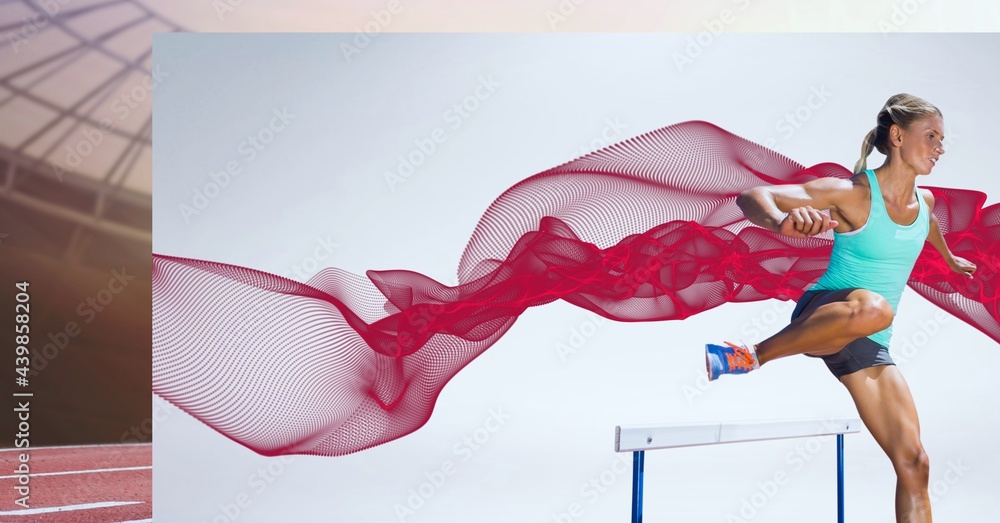 Caucasian female athlete jumping over a hurdle against digital wave on grey screen and sports field