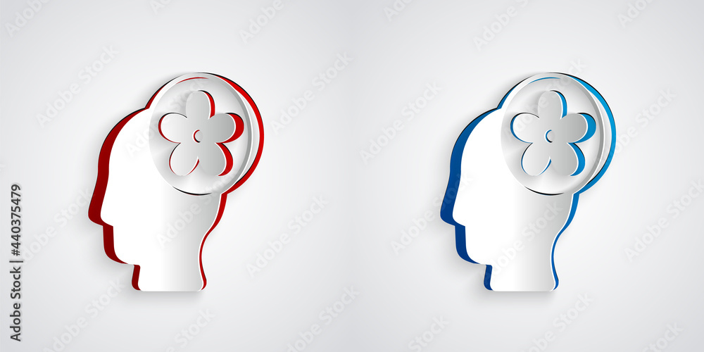 Paper cut Human head with flower inside icon isolated on grey background. Paper art style. Vector