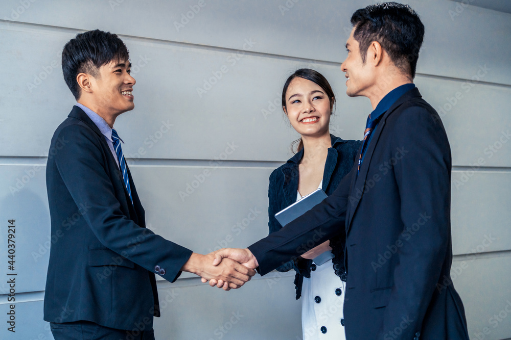 Business people agreement concept. Businessman do handshake with another businessman in the office m