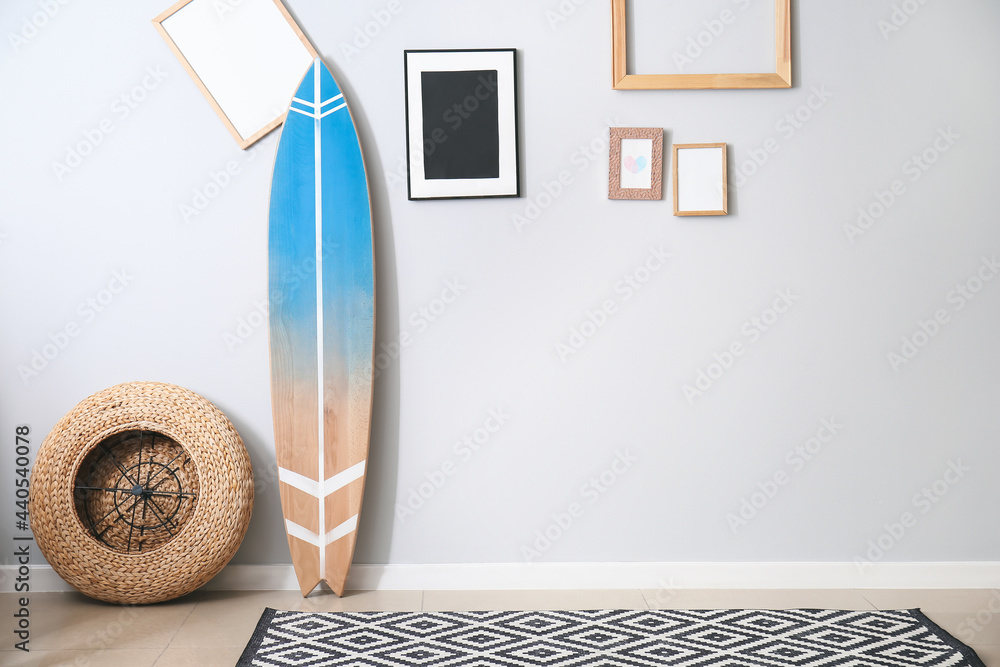 Interior of modern stylish room with surfboard