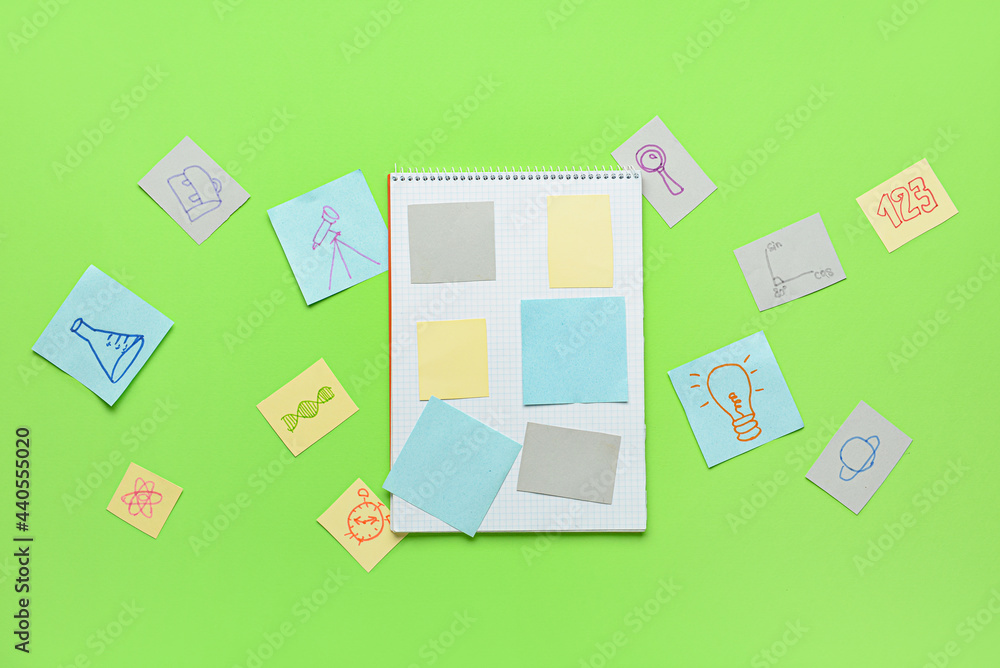 Notebook with papers on color background. Back to school