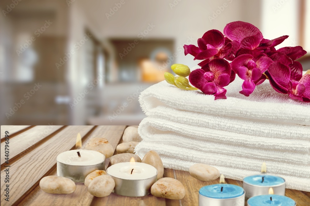 Spa concept with candles, natural organic soaps, towels for skin treatments