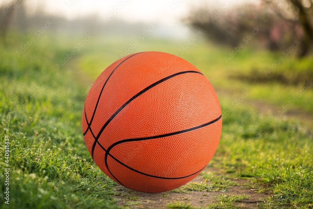 New orange basketball ball on the floor