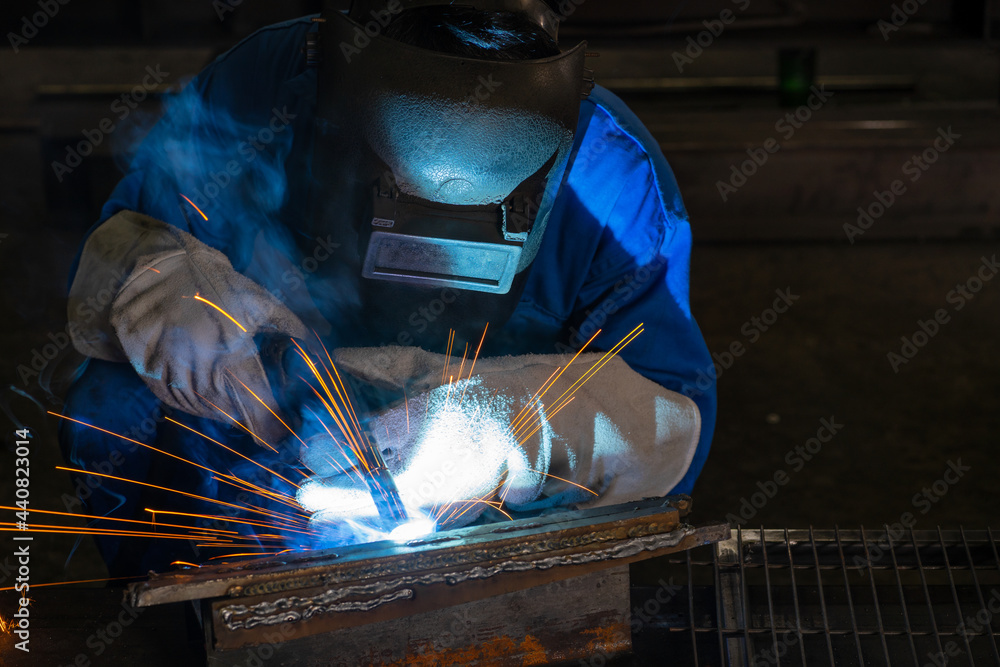 A male worker chia steel in an industrial factory. Concept industry.