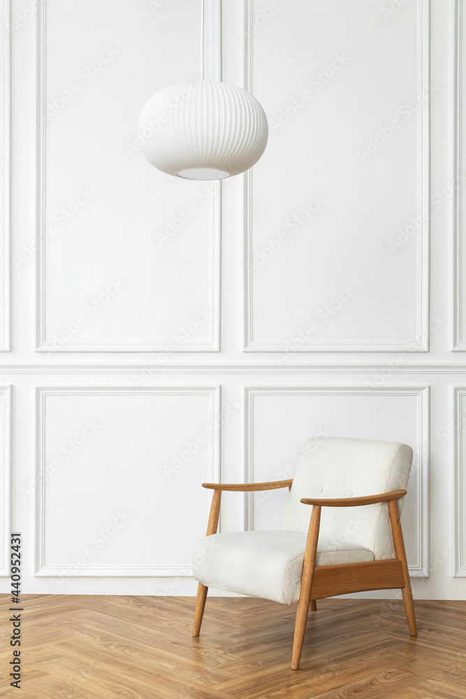 Vintage armchair and white wall in minimal style