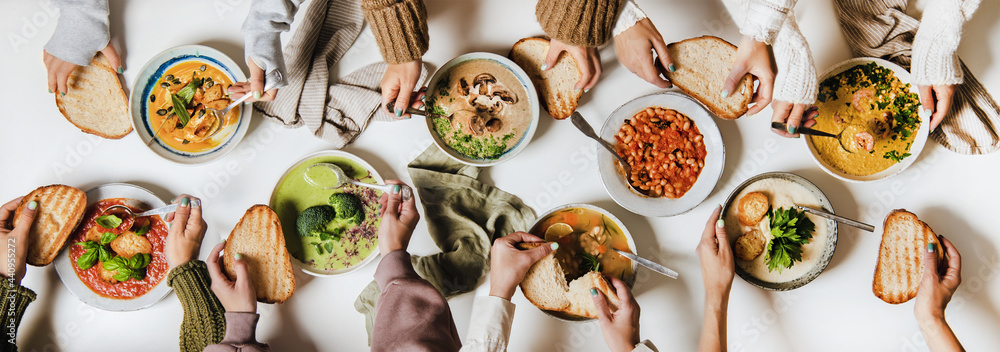 People eating various Autumn and Winter creamy vegan soups together