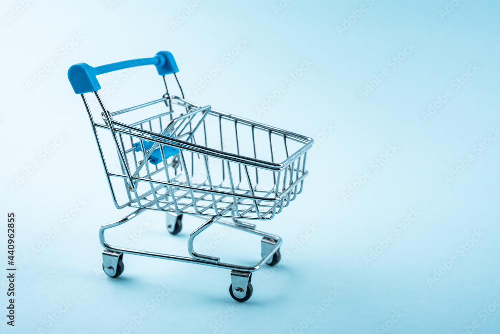 A shopping cart on a blue background