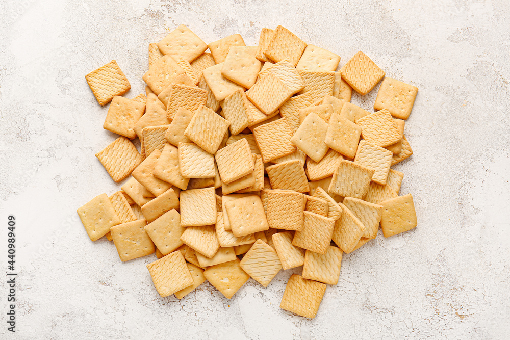 Tasty crackers on light background