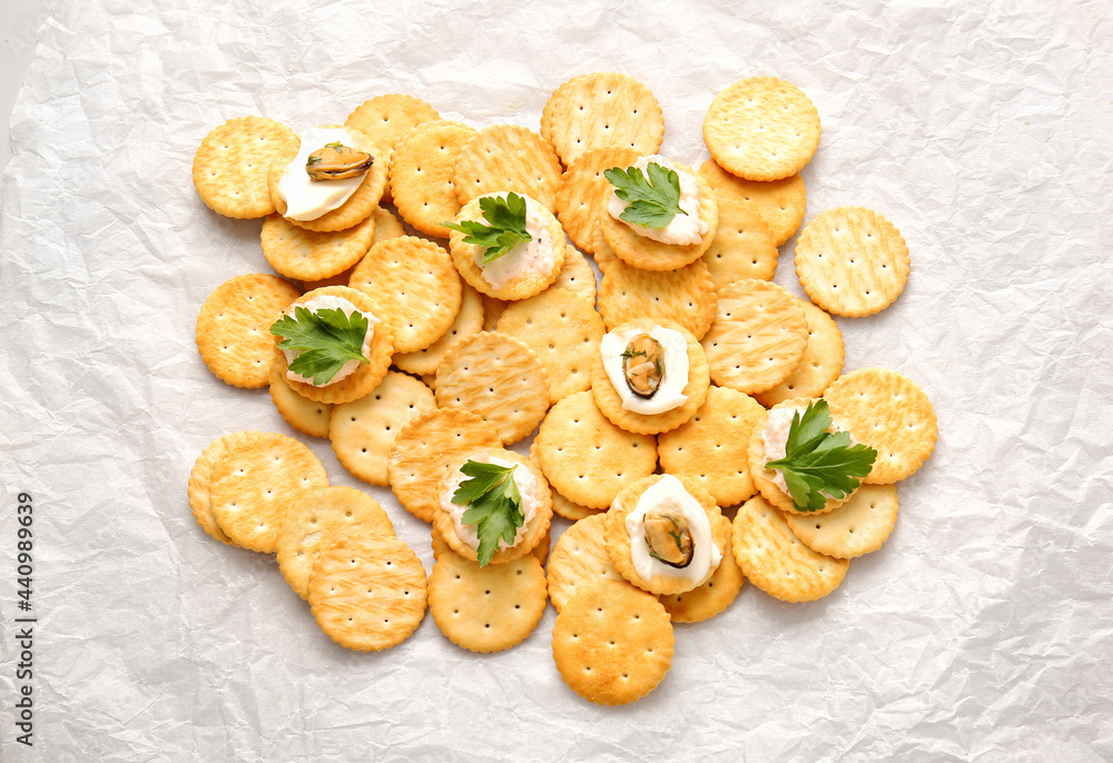 Tasty crackers on baking parchment